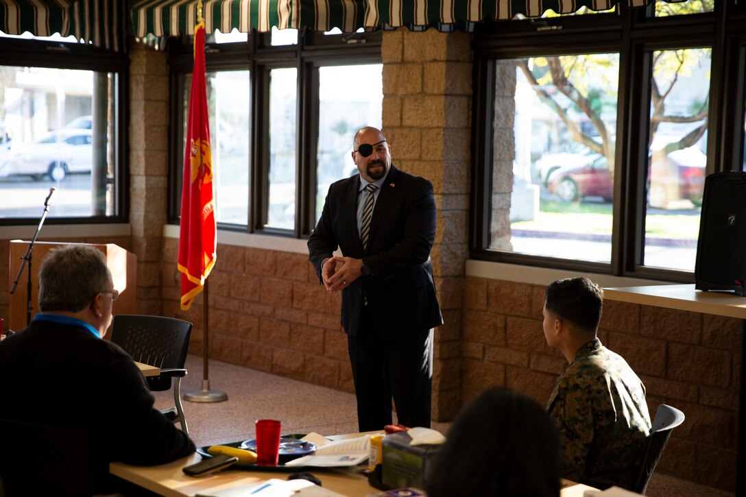Ret. GySgt. Nicholas Popaditch, former Marine and motivational speaker, shares his experiences during the National Prayer Breakfast at Marine Corps Air Station Miramar, Calif., Feb. 7. The National Prayer Breakfast is a yearly event that is designed to be a forum for professionals in the political, social and business worlds to assemble and build relationships. (U.S. Marine Corps photo by Cpl. Preston Hightower)