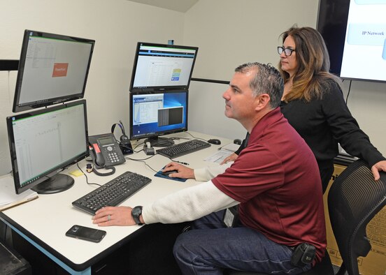 Fernando Sanchez and Minta Huddleston, 412th Civil Engineer Squadron, work in the new Industrial Control Systems Innovation Lab Feb. 7. The ICS Innovation Lab will be used primarily by field service technicians to research, develop, test and evaluate new and existing controls on Heating, Ventilation and Air Conditioning Equipment, water distribution, emergency power, sewage and more. (U.S. Air Force photo by Kenji Thuloweit)