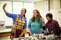 Learning the roots: station residents dig lotus roots