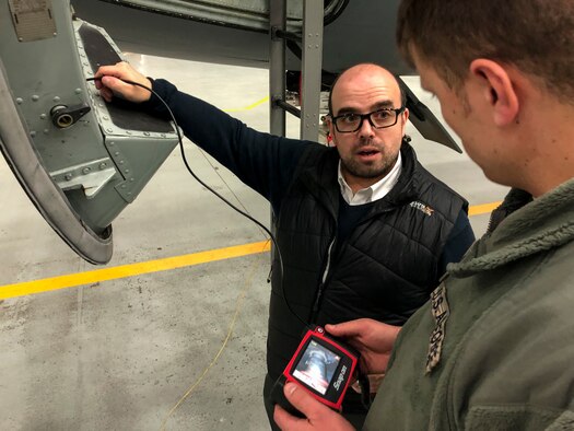 Snap-on Industrial representative Matt Elliston shows Staff Sgt. Tommy James, 100th Maintenance Squadron propulsion systems craftsman, a digital inspection kit during a technology demonstration at RAF Mildenhall, England, Jan. 31, 2019. The 100th MXS is seeking funds to purchase the kit, as well as a “smart toolbox” to free up more time to work on their aircraft. (U.S. Air Force photo by Senior Airmen Kelly O’Connor)
