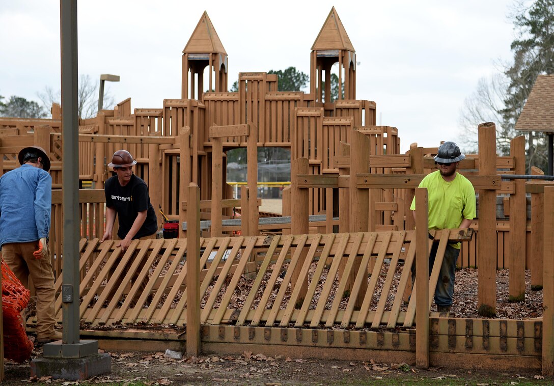 Construction workers disassemble pieces of Freedom Park during demolition Feb. 6, 2019, on Columbus Air force Base, Mississippi. The Freedom Park playground was built in 1996, a time when playgrounds were typically constructed with wooden materials. (U.S. Air Force photo by Airman Hannah Bean)