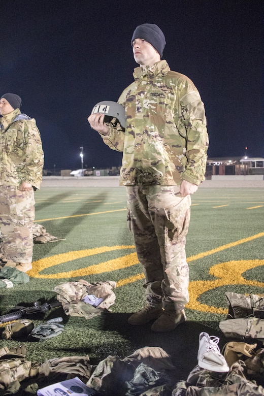 United States Army Sgt. Richie Schellhorn, assigned to 395th Ordnance Company out of Appleton, Wisconsin, shows accountability of his ruck sack items to air assault instructors during day two of Air Assault School’s Class 301-19 on Feb. 7, 2019, at Camp Buehring, Kuwait. Developing a prepared and capable leader is one of the U.S. Army’s modernization efforts.
