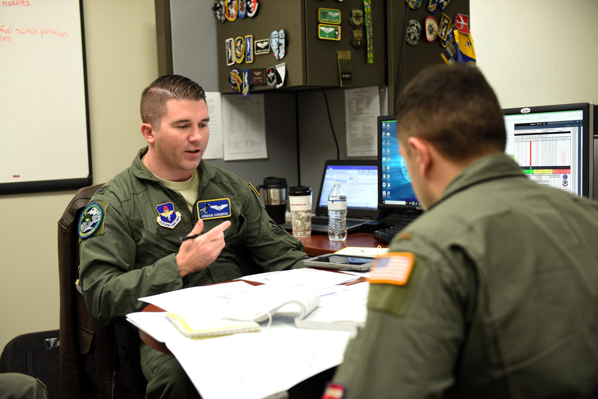 Capt. Jordon Cosgrove, 48th Flying Training Squadron instructor pilot (IP), plans a training sortie with a Specialized Undergraduate Pilot Training student Feb. 5, 2019, on Columbus Air Force Base, Mississippi. While planning a training sortie, IPs and student pilots must factor in weather conditions and many other variable obstacles that may happen during their flight. (U.S. Air Force photo by Senior Airman Beaux Hebert)
