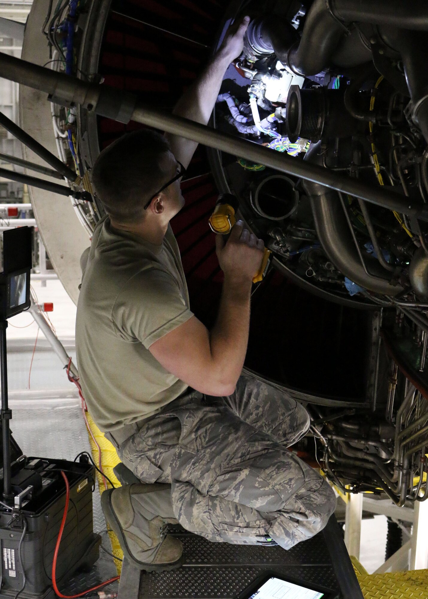 Tech. Sgt. Adam Sotak, 445th Maintenance Squadron crew chief, inspects a C-17 Globemaster III engine January 6, 2019. The four engines on the C-17 Globemaster III create a tremendous amount of thrust to achieve its cruising speed of 515 mph.  (U.S. Air Force photo /Senior Airman Ethan Spickler)