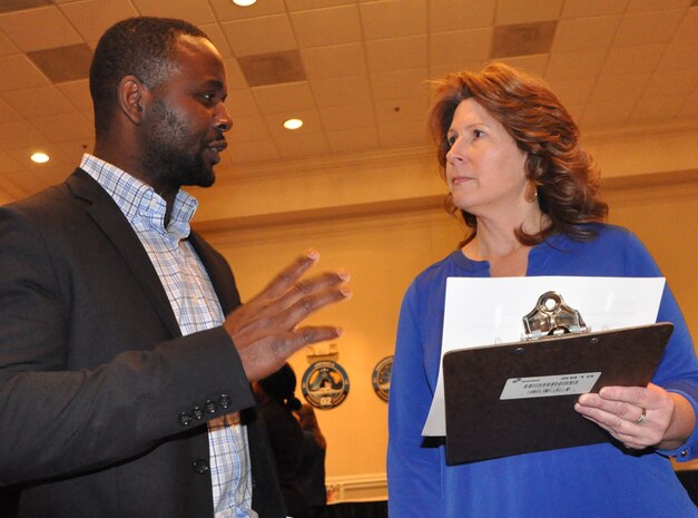 IMAGE: FREDERICKSBURG, Va. (Feb. 5, 2019) - A Naval Surface Warfare Center Dahlgren Division (NSWCDD) representative discusses career opportunities with a candidate at the NSWCDD Career Fair. The command made 36 on-the-spot job offers at the event held in the Fredericksburg Expo and Conference Center. "This is the first year that we opened the event up to non-science and engineering positions and we had an overwhelming response for our contract, financial, and information technology positions," said Shelby Khan, the NSWCDD Human Resources Recruiting Program lead. "We anticipate additional interviews and offers resulting from the career fair in the weeks to come."