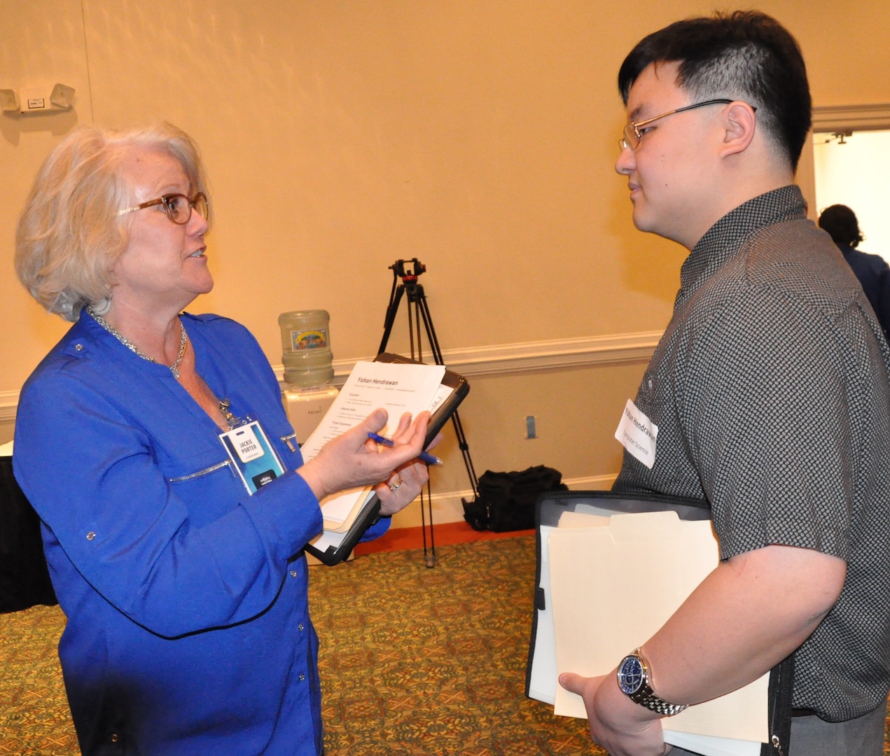 IMAGE: FREDERICKSBURG, Va. (Feb. 5, 2019) - A Naval Surface Warfare Center Dahlgren Division (NSWCDD) representative discusses career opportunities with a candidate at the NSWCDD Career Fair. The command made 36 on-the-spot job offers at the event held in the Fredericksburg Expo and Conference Center. "This is the first year that we opened the event up to non-science and engineering positions and we had an overwhelming response for our contract, financial, and information technology positions," said Shelby Khan, the NSWCDD Human Resources Recruiting Program lead. "We anticipate additional interviews and offers resulting from the career fair in the weeks to come."