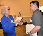 IMAGE: FREDERICKSBURG, Va. (Feb. 5, 2019) - A Naval Surface Warfare Center Dahlgren Division (NSWCDD) representative discusses career opportunities with a candidate at the NSWCDD Career Fair. The command made 36 on-the-spot job offers at the event held in the Fredericksburg Expo and Conference Center. "This is the first year that we opened the event up to non-science and engineering positions and we had an overwhelming response for our contract, financial, and information technology positions," said Shelby Khan, the NSWCDD Human Resources Recruiting Program lead. "We anticipate additional interviews and offers resulting from the career fair in the weeks to come."