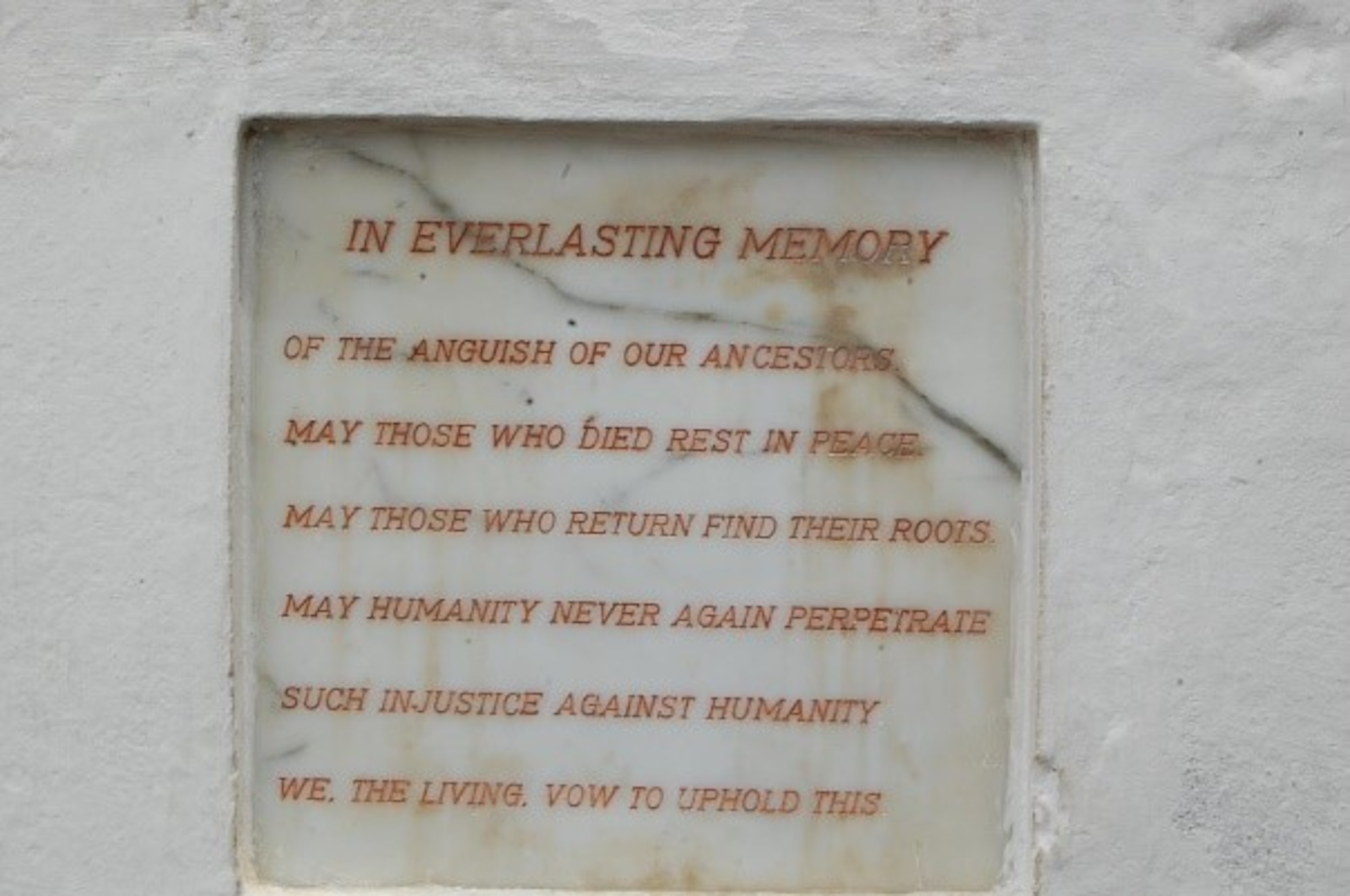 Ghana's pledge to never again perpetrate the injustice of slavery from their Coasts engraved at one of the Cape Coast castles that housed the slaves prior to their transatlantic trip. (Courtesy photo/Breanna McGowan)