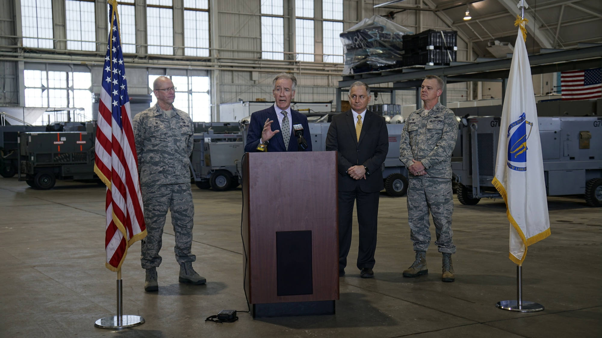 Group shot of 439th Airlift Wing Commander D. Scott Durham, Chicopee Mayor Richard Kos, U.S. Congressman Richard Neal, and 439th Maintenance Group Commander Col. David Post in Hangar 9, one of Westover's 80-year-old hangars.