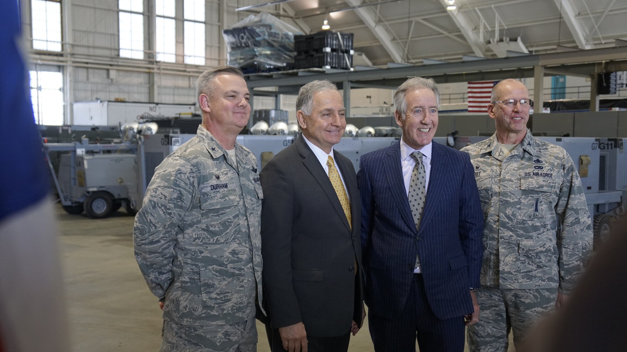 Group shot of 439th Airlift Wing Commander D. Scott Durham, Chicopee Mayor Richard Kos, U.S. Congressman Richard Neal, and 439th Maintenance Group Commander Col. David Post in Hangar 9, one of Westover's 80-year-old hangars.