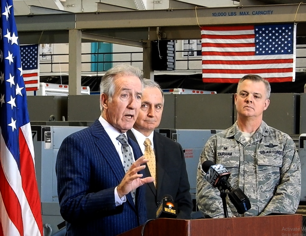 U.S. Congressman Richard Neal speaks at the podium in Hangar 9.