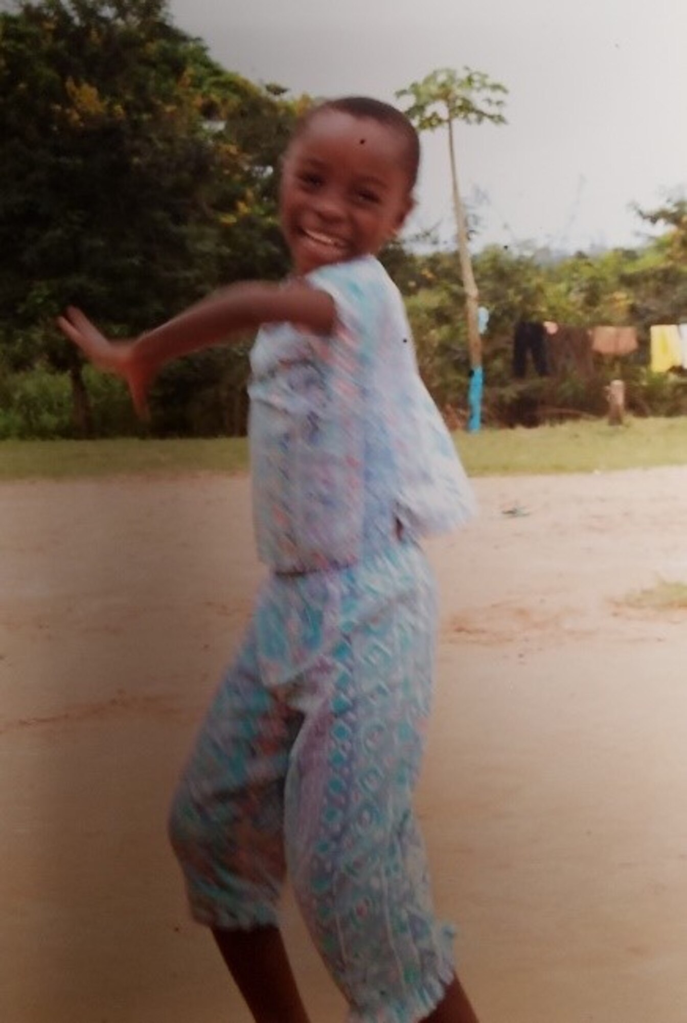 A Ghanaian orphan girl twirling at the orphanage. (Courtesy photo/Breanna McGowan)