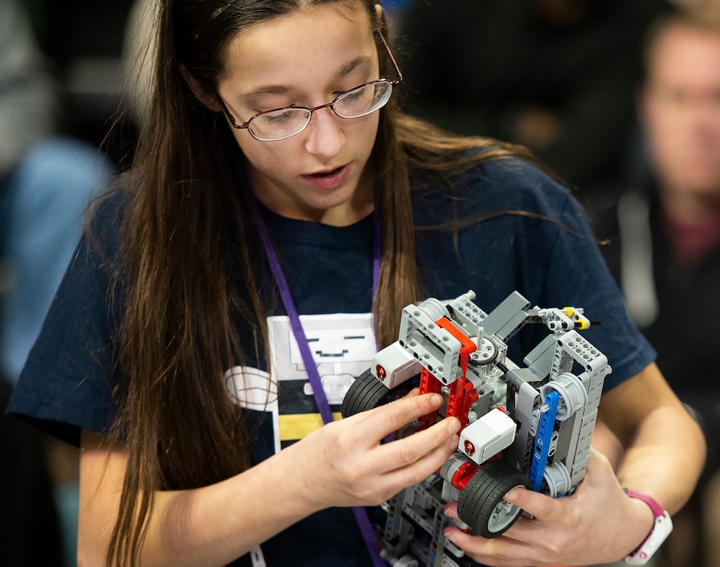Tabitha Blankenship, 13, works on the Buzz, Buzz, Sting Sting team robot during the FIRST LEGO League Ohio championship tournament.