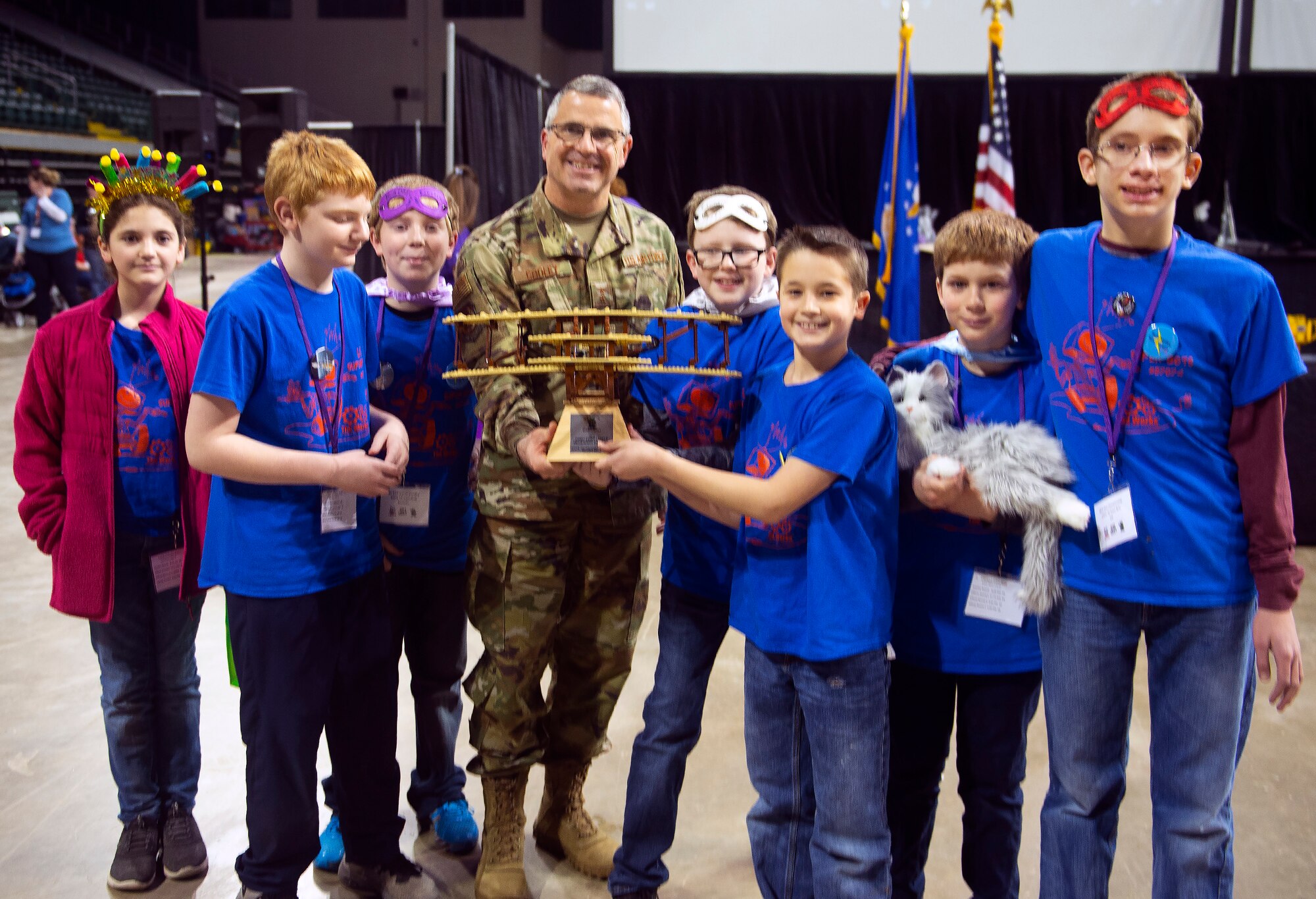 Maj. Gen. William T. Cooley, Air Force Research Laboratory commander, presents the Wright-Patterson Air Force Base Founder’s Award to the LV Super Bots at the FIRST LEGO League Tournament in the Wright State University Nutter Center Feb. 3.