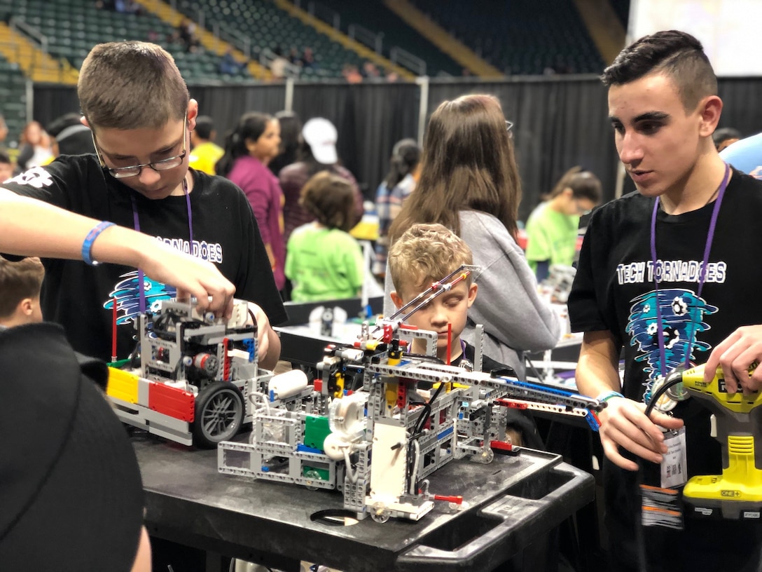 Team Tech Tornadoes work on their robot at the FIRST LEGO League Ohio championship tournament Feb. 3.