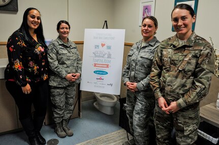 Mamie Futrell, 628th Air Base Wing sexual assault response coordinator for the Air Base, stands with military members to highlight the opening of the new pumping room Jan. 11, 2019, in the Child Development Center at Joint Base Charleston – Air Base.
