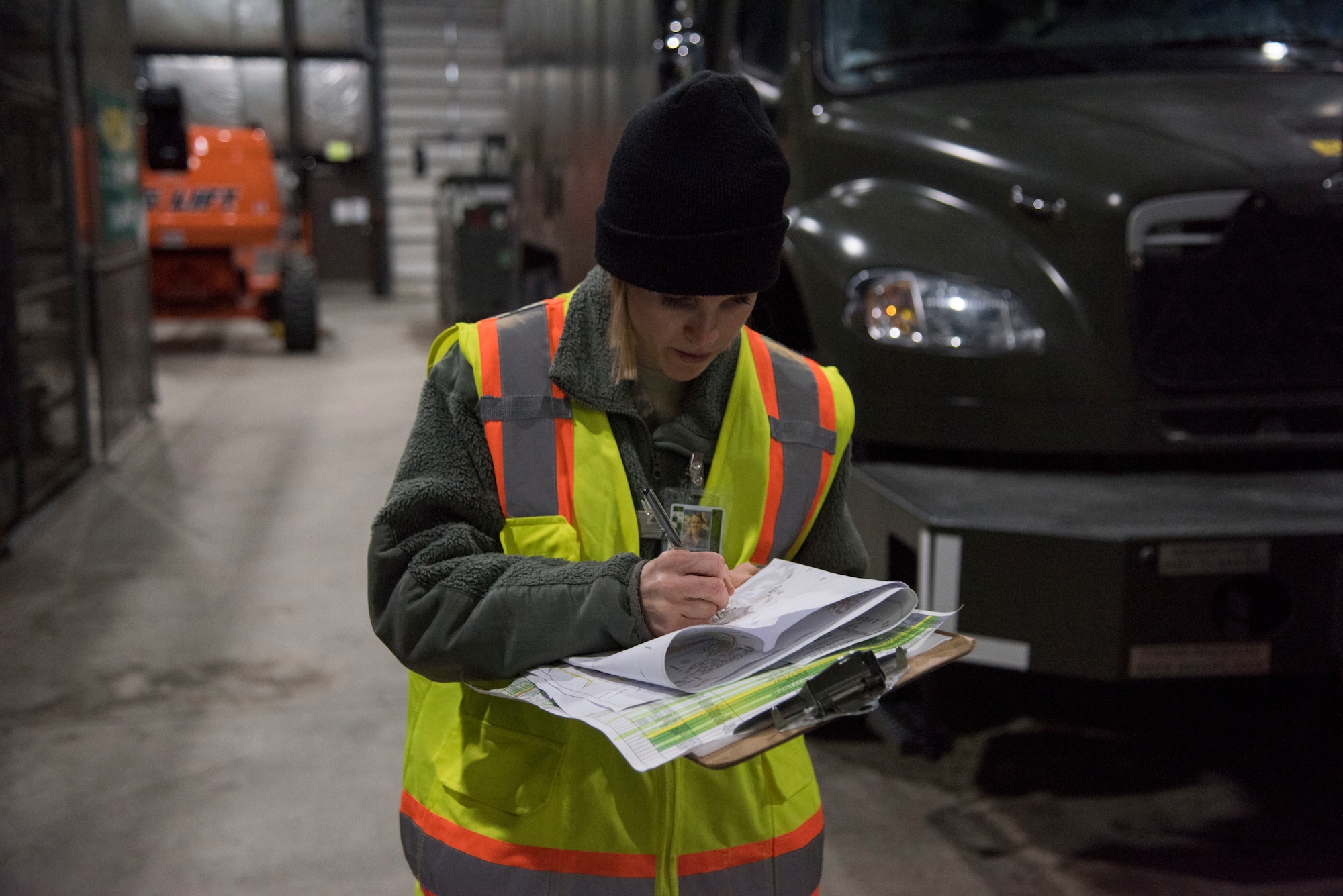 U.S. Air Force Staff Sgt. Courtney Kohnke, 673d Civil Engineer Squadron construction inspector, writes notes during a post-earthquake, facility inspection at Joint Base Elmendorf-Richardson, Alaska, Jan. 31, 2019. Since the Nov. 30, 2018 earthquake more than 20 CES Airmen have been trained in the ATC-20-1 Post-earthquake Safety Evaluation of Buildings to maintain and improve agile support capabilities.