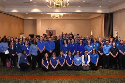 IMAGE: Employees of the Naval Surface Warfare Center Dahlgren Division (NSWCDD) pose for a photo during a job fair held at the Fredericksburg Expo and Conference Center, Feb. 5. NSWCDD made 36 on-the-spot job offers at the event held in the Fredericksburg Expo and Conference Center. In all, 313 candidates with bachelor's, master's, and doctoral degrees in technical and business fields inquired about positions available for entry-level and experienced scientists, engineers, and business professionals.