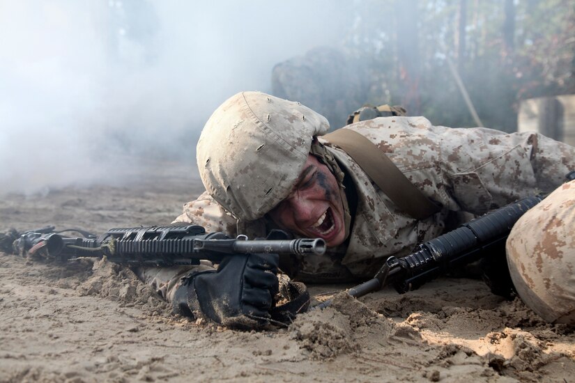 Marine crawls through sand