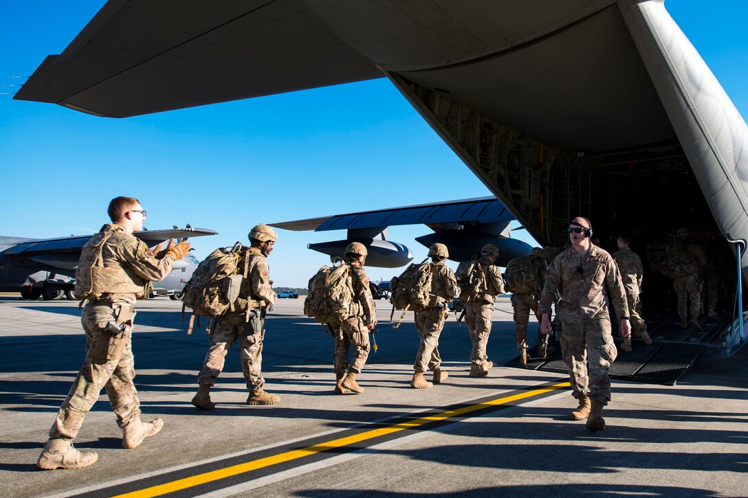 Airmen from the 823d Base Defense Squadron (BDS) board an HC-130J Combat King II during airfield security training, Jan. 28, 2019, at Moody Air Force Base, Ga. The training was geared toward bolstering the 823d BDS’s adaptive base readiness, which consisted of improving Airmen’s capabilities to effectively and efficiently on-load equipment along with more than 30 fully-equipped personnel into an aircraft, followed by establishing airfield security. (U.S. Air Force photo by Airman 1st Class Erick Requadt)