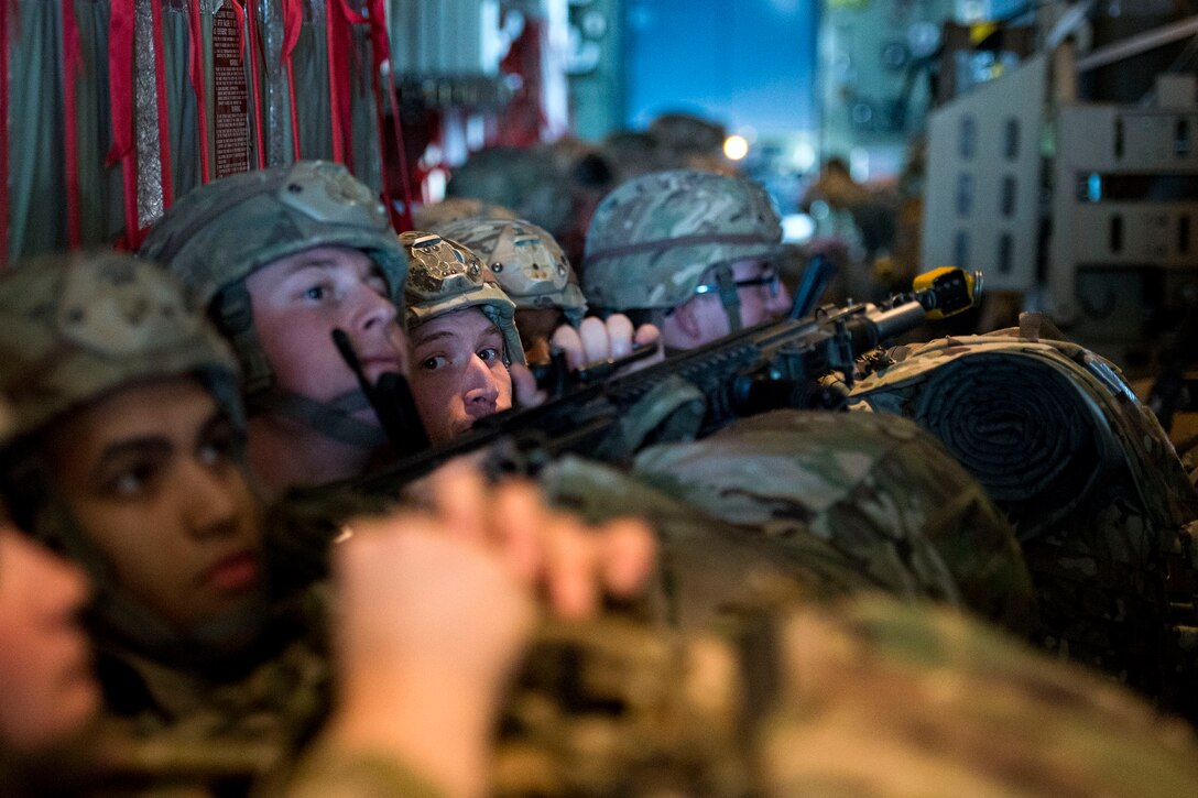 Airmen from the 823d Base Defense Squadron (BDS) wait to exit an HC-130J Combat King II during airfield security training, Jan. 28, 2019, at Moody Air Force Base, Ga. The training was geared toward bolstering the 823d BDS’s adaptive base readiness, which consisted of improving Airmen’s capabilities to effectively and efficiently on-load equipment along with more than 30 fully-equipped personnel into an aircraft, followed by establishing airfield security. (U.S. Air Force photo by Airman 1st Class Erick Requadt)