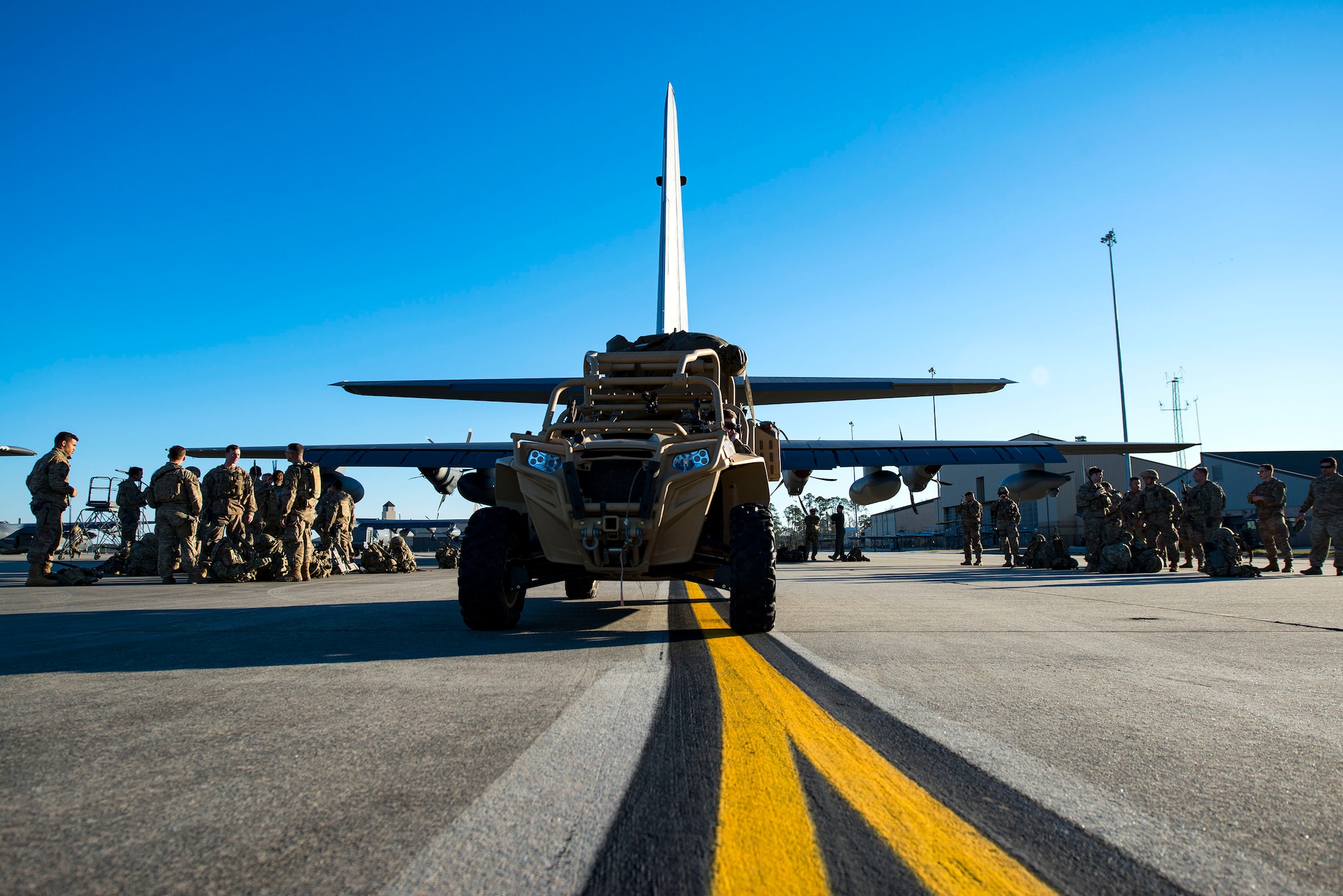 Airmen from the 823d Base Defense Squadron (BDS) prepare to board an HC-130J Combat King II during airfield security training, Jan. 28, 2019, at Moody Air Force Base, Ga. The training was geared toward bolstering the 823d BDS’s adaptive base readiness, which consisted of improving Airmen’s capabilities to effectively and efficiently on-load equipment along with more than 30 fully-equipped personnel into an aircraft, followed by establishing airfield security. (U.S. Air Force photo by Airman 1st Class Erick Requadt)