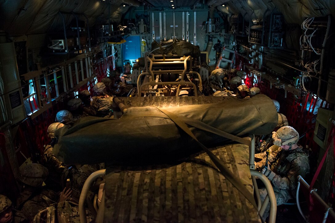 Airmen from the 823d Base Defense Squadron (BDS) fit into an HC-130J Combat King II during airfield security training, Jan. 28, 2018, at Moody Air Force Base, Ga. The training was geared toward bolstering the 823d BDS’s adaptive base readiness, which consisted of improving Airmen’s capabilities to effectively and efficiently on-load equipment along with more than 30 fully-equipped personnel into an aircraft, followed by establishing airfield security. (U.S. Air Force photo by Airman 1st Class Erick Requadt)