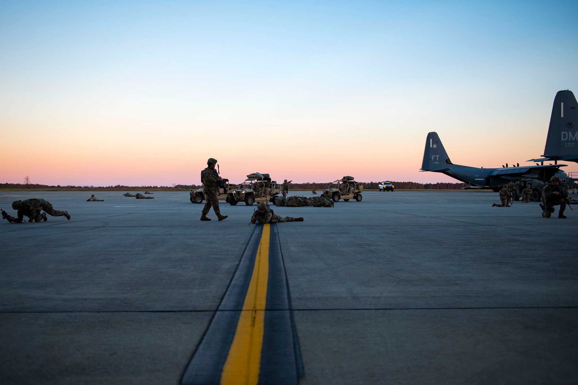 Airmen from the 823d Base Defense Squadron (BDS) set up airfield security during airfield security training, Jan. 28, 2019, at Moody Air Force Base, Ga. The training was geared toward bolstering the 823d BDS’s adaptive base readiness, which consisted of improving Airmen’s capabilities to effectively and efficiently on-load equipment along with more than 30 fully-equipped personnel into an aircraft, followed by establishing airfield security. (U.S. Air Force photo by Airman 1st Class Erick Requadt)