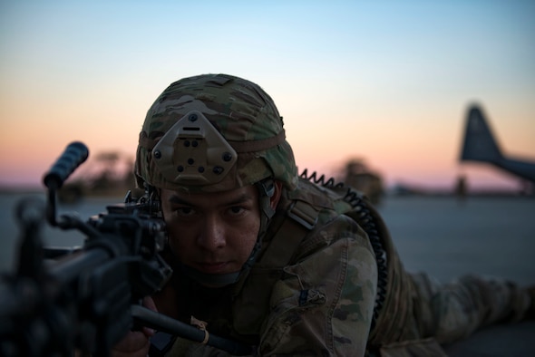 Airman 1st Class Paul Cabuhat, 823d Base Defense Squadron (BDS) fireteam member, sets security during airfield security training, Jan. 28, 2019, at Moody Air Force Base, Ga. The training was geared toward bolstering the 823d BDS’s adaptive base readiness, which consisted of improving Airmen’s capabilities to effectively and efficiently on-load equipment along with more than 30 fully-equipped personnel into an aircraft, followed by establishing airfield security. (U.S. Air Force photo by Airman 1st Class Erick Requadt)
