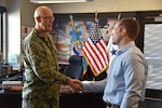 Distribution acquisition specialist honored with commander coin