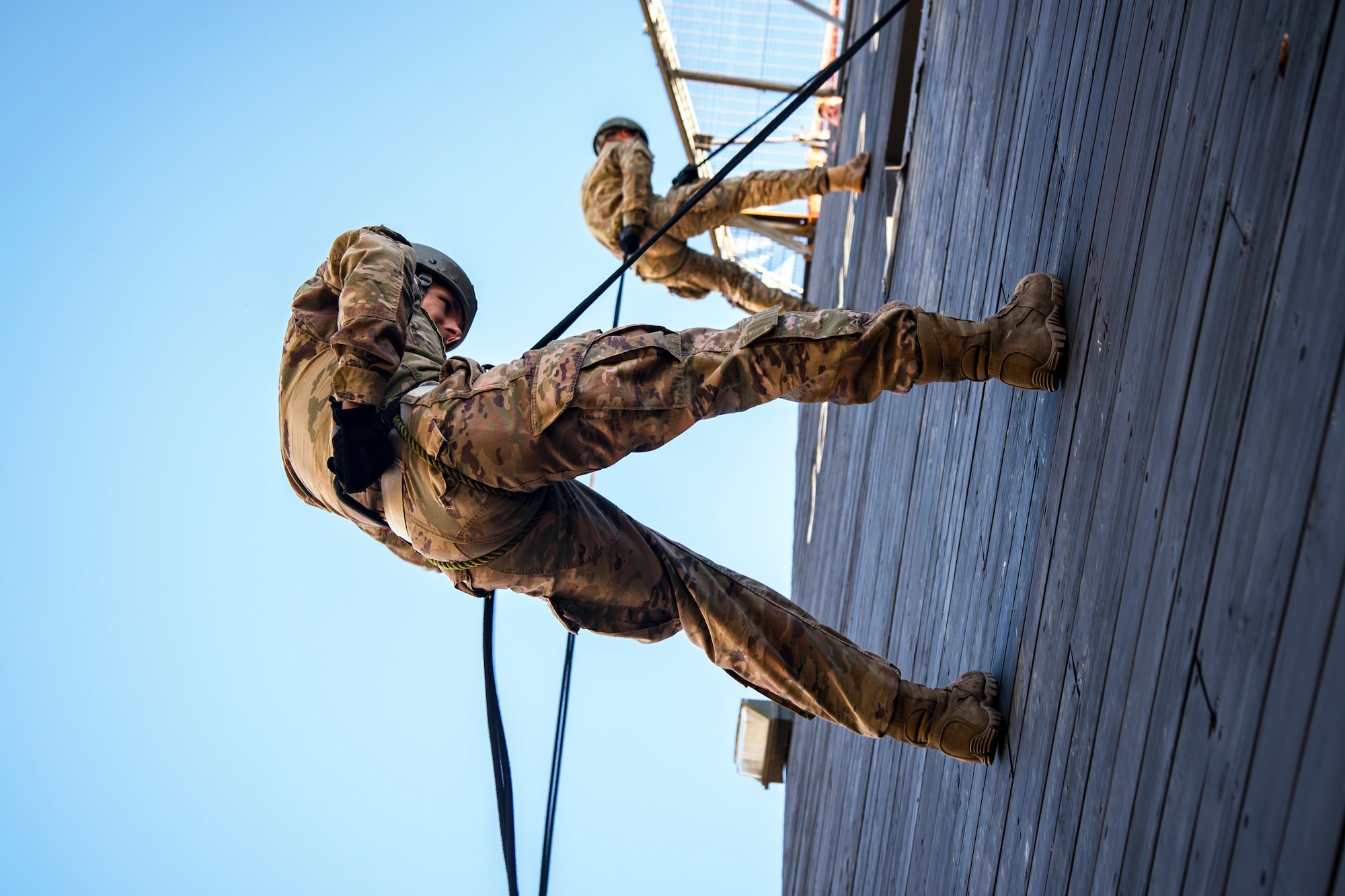 Airmen perform the brake technique prior to rappelling down the Safe Rappel Tower during an Army Air Assault Assessment, Jan. 28, 2019, at Moody Air Force Base, Ga. Airmen demonstrated their comprehensive rappel tower knowledge to help determine their overall readiness for Army Air Assault school (U.S. Air Force photo by Airman First Class Eugene Oliver)