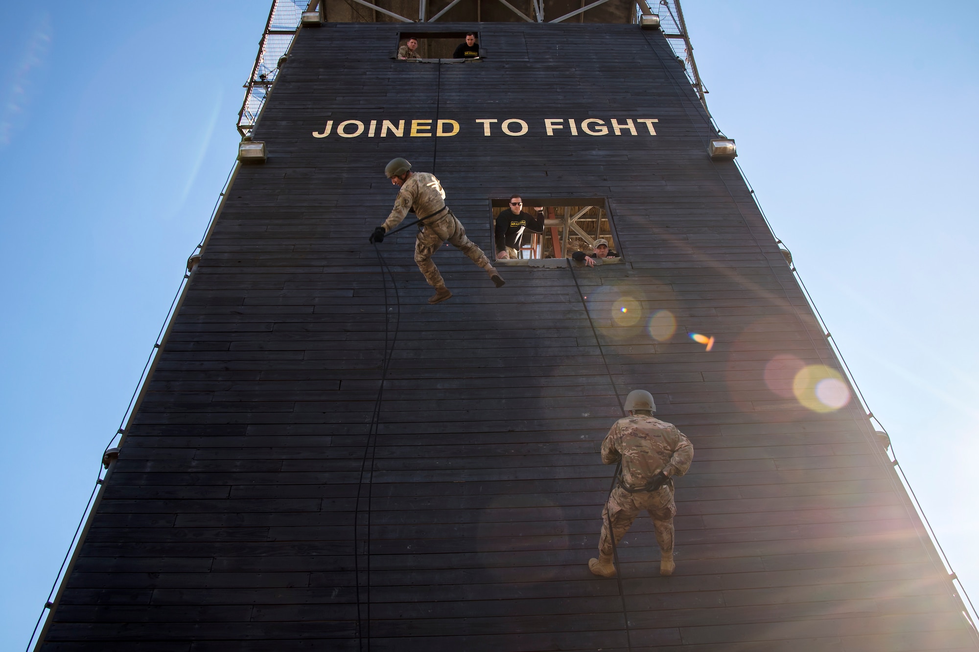 Airmen rappel down the Safeside Rappel tower during an Army Air Assault Assessment (AAA), Jan. 28, 2019, at Moody Air Force Base, Ga. Airmen demonstrated their comprehensive rappel tower knowledge to help determine their overall readiness for Army Air Assault school (U.S. Air Force photo by Airman First Class Eugene Oliver)