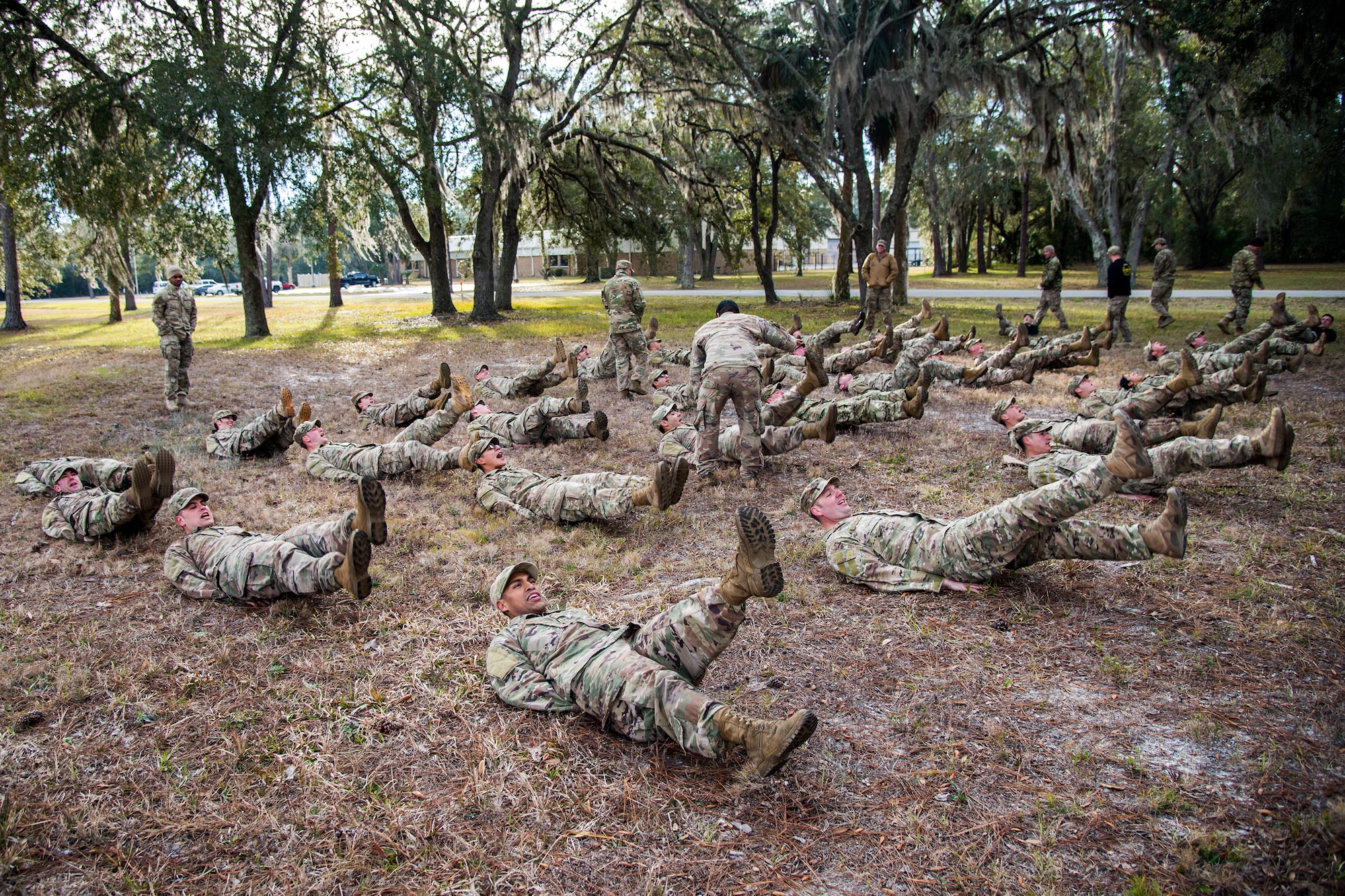 Airmen perform flutter-kicks during an Army Air Assault Assessment (AAA), Jan. 30, 2019, at Camp Blanding, Fla. The AAA is designed to determine Airmen’s physical and mental readiness before being selected to attend Army Air Assault school. (U.S. Air Force photo by Airman First Class Eugene Oliver)