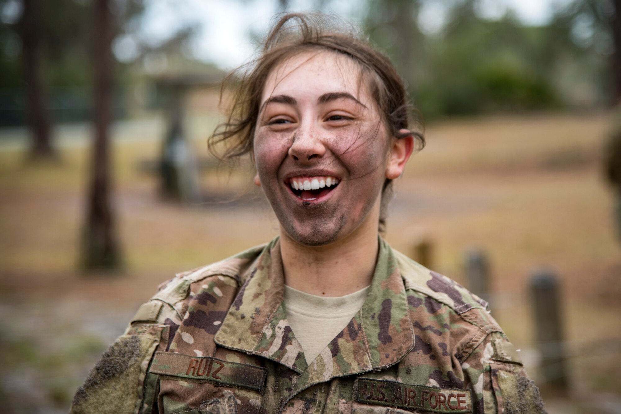 Airman First Class Madison Ruiz, 823d Base Defense Squadron security forces member, smiles after finishing the last obstacle during an Army Air Assault Assessment, Jan 30, 2019, at Camp Blanding, Fla. Throughout the assessment, cadres challenged Airmen’s physical and mental limits to determine who would be selected prior to attending Army Air Assault School. (U.S. Air Force photo by Airman First Class Eugene Oliver)