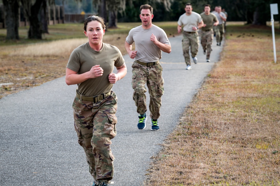 Airmen run the 2-mile portion of the Army Physical Fitness test as part of an Army Air Assault Assessment, Jan. 30, 2019, at Camp Blanding, Fla. Throughout the assessment, cadres challenged Airmen’s physical and mental limits to determine who would be selected prior to attending Army Air Assault School. (U.S. Air Force photo by Airman First Class Eugene Oliver)