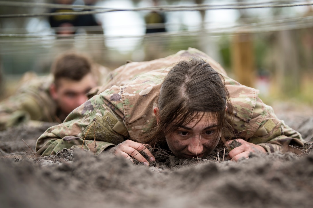 Airman First Class Madison Ruiz, 823 Base Defense Squadron security forces member, low crawls through an obstacle during an Army Air Assault Assessment (AAA), Jan. 30, 2019, at Camp Blanding, Fla. The AAA is designed to determine Airmen’s physical and mental readiness before being selected to attend Army Air Assault school. (U.S. Air Force photo by Airman First Class Eugene Oliver)