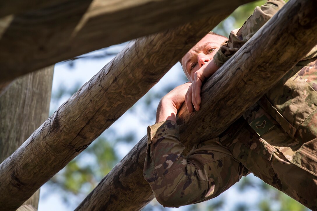 Airman 1st Class Kasey Dybas, 822d Base Defense Squadron fireteam member, navigates through the weaver obstacle during an Army Air Assault Assessment (AAA), Jan. 30, 2019, at Camp Blanding, Fla. The AAA is designed to determine Airmen’s physical and mental readiness before being selected to attend Army Air Assault school. (U.S. Air Force photo by Airman First Class Eugene Oliver)