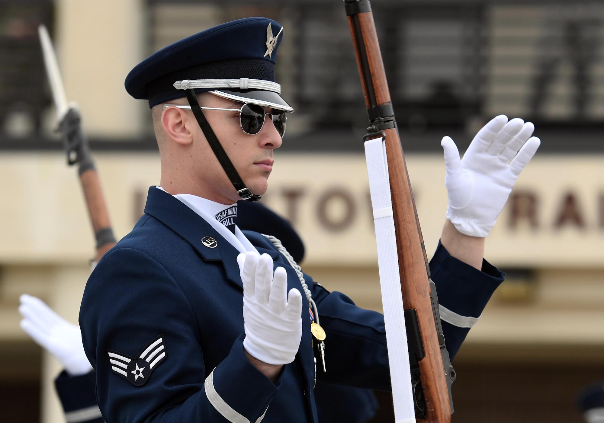 U.S. Air Force Senior Airman Nathan Leslie, U.S. Air Force Honor Guard Drill Team member, participates in the debut performance of the team's 2019 routine in front of Keesler leadership and 81st Training Group Airmen on the Levitow Training Support Facility drill pad at Keesler Air Force Base, Mississippi, Feb. 8, 2019. The team comes to Keesler every year for five weeks to develop a new routine that they will use throughout the year. (U.S. Air Force photo by Kemberly Groue)