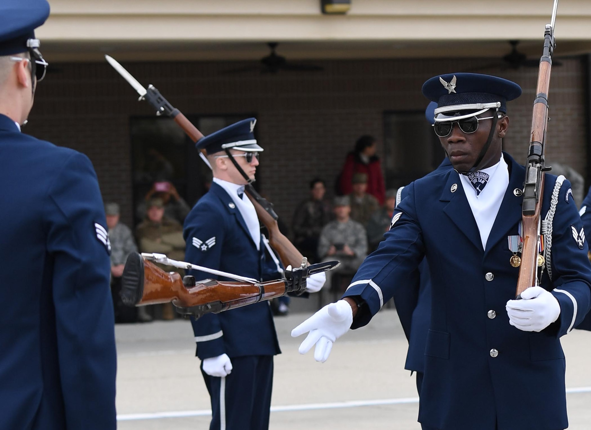 U.S. Air Force Senior Airman Colby Marshall, U.S. Air Force Honor Guard Drill Team member, participates in the debut performance of the team's 2019 routine in front of Keesler leadership and 81st Training Group Airmen on the Levitow Training Support Facility drill pad at Keesler Air Force Base, Mississippi, Feb. 8, 2019. The team comes to Keesler every year for five weeks to develop a new routine that they will use throughout the year. (U.S. Air Force photo by Kemberly Groue)