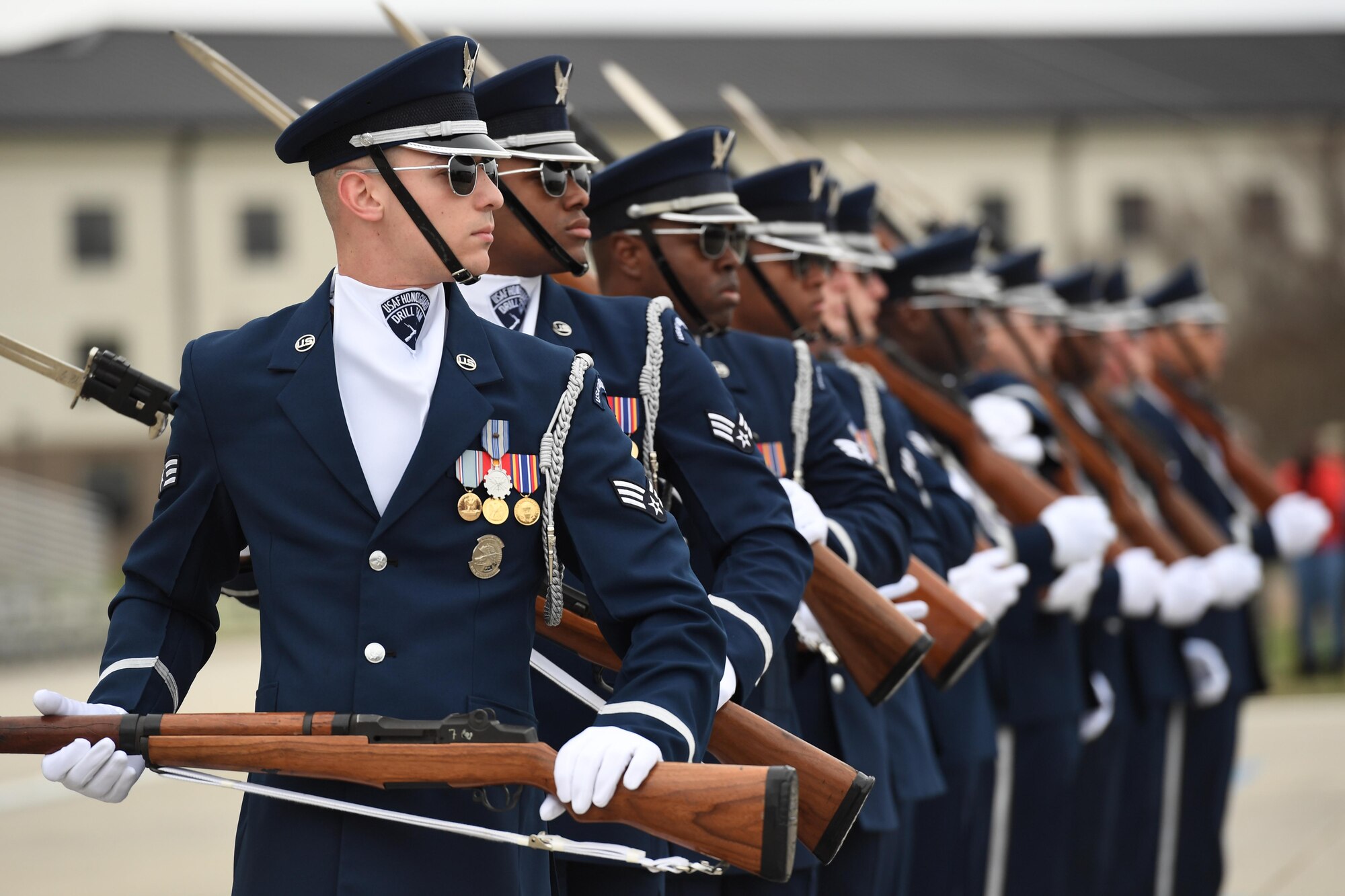 The U.S. Air Force Honor Guard Drill Team debuts their 2019 routine in front of Keesler leadership and 81st Training Group Airmen on the Levitow Training Support Facility drill pad at Keesler Air Force Base, Mississippi, Feb. 8, 2019. They are the nation's most elite honor guard, serving the President of the United States, the Air Force's most senior leaders and performing nationwide for the American public. The team comes to Keesler every year for five weeks to develop a new routine that they will use throughout the year. (U.S. Air Force photo by Kemberly Groue)