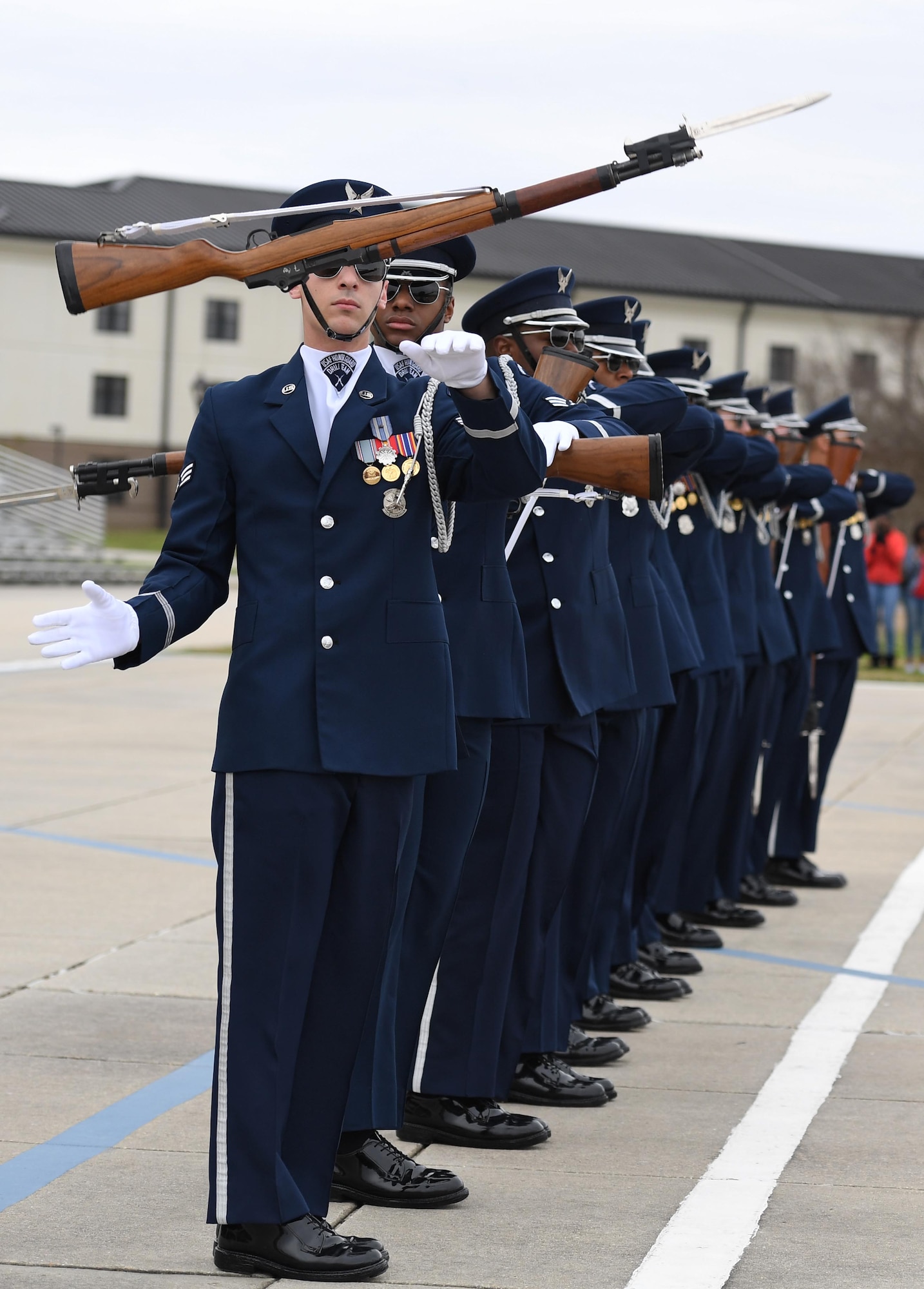 The U.S. Air Force Honor Guard Drill Team debuts their 2019 routine in front of Keesler leadership and 81st Training Group Airmen on the Levitow Training Support Facility drill pad at Keesler Air Force Base, Mississippi, Feb. 8, 2019. They are the nation's most elite honor guard, serving the President of the United States, the Air Force's most senior leaders and performing nationwide for the American public. The team comes to Keesler every year for five weeks to develop a new routine that they will use throughout the year. (U.S. Air Force photo by Kemberly Groue)