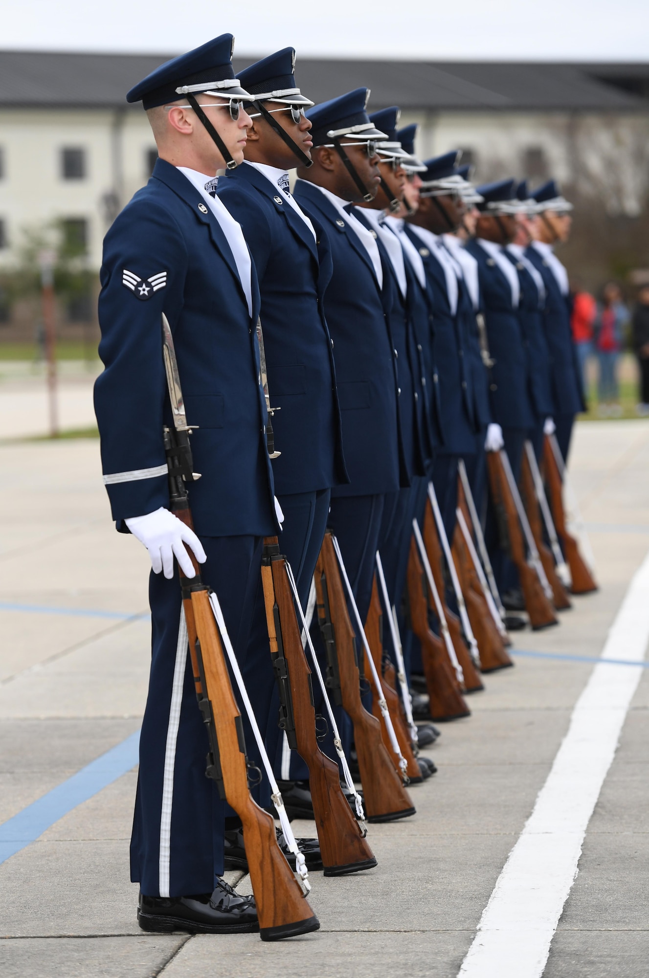 The U.S. Air Force Honor Guard Drill Team debuts their 2019 routine in front of Keesler leadership and 81st Training Group Airmen on the Levitow Training Support Facility drill pad at Keesler Air Force Base, Mississippi, Feb. 8, 2019. They are the nation's most elite honor guard, serving the President of the United States, the Air Force's most senior leaders and performing nationwide for the American public. The team comes to Keesler every year for five weeks to develop a new routine that they will use throughout the year. (U.S. Air Force photo by Kemberly Groue)