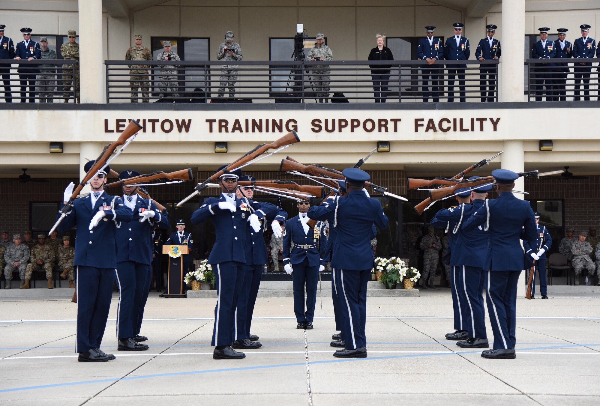 The U.S. Air Force Honor Guard Drill Team debuts their 2019 routine in front of Keesler leadership and 81st Training Group Airmen on the Levitow Training Support Facility drill pad at Keesler Air Force Base, Mississippi, Feb. 8, 2019. They are the nation's most elite honor guard, serving the President of the United States, the Air Force's most senior leaders and performing nationwide for the American public. The team comes to Keesler every year for five weeks to develop a new routine that they will use throughout the year. (U.S. Air Force photo by Kemberly Groue)