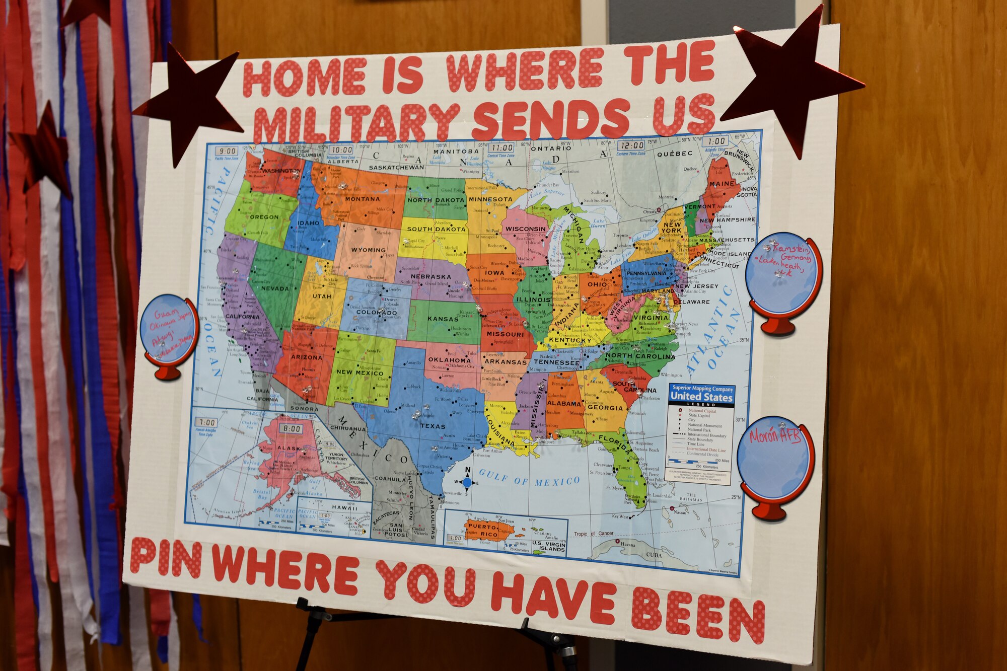 Spouses attending the Key Spouses' Program All Call place pins at all the locations they have been on a map provided by Hiring our Heroes at the Event Center, Goodfellow Air Force Base, Texas, Feb. 7, 2019. The spouses were able to see where everyone else has been and potentially share their stories. (U.S. Air Force photo by Airman 1st Class Zachary Chapman/Released)