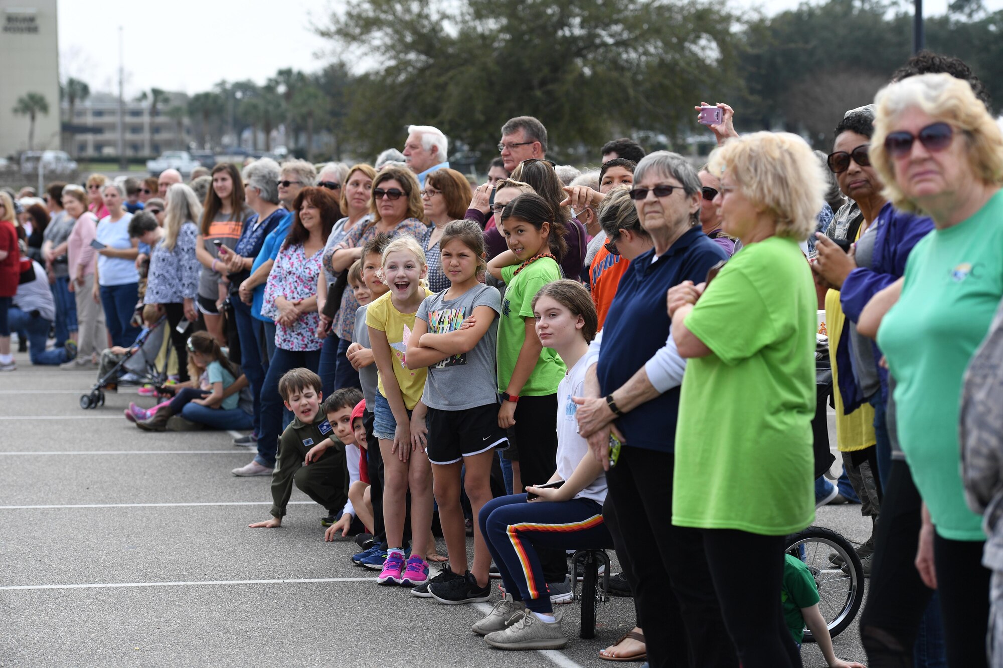 Keesler families line the base exchange parking lot to view the Budweiser Clydesdales as they make an appearance at Keesler Air Force Base, Mississippi, Feb. 7, 2019. They made their first appearance in 1933 and have been featured prominently in two presidential inaugurations. The Keesler Base Exchange hosted the event for Airmen and their families to enjoy. (U.S. Air Force photo by Kemberly Groue)