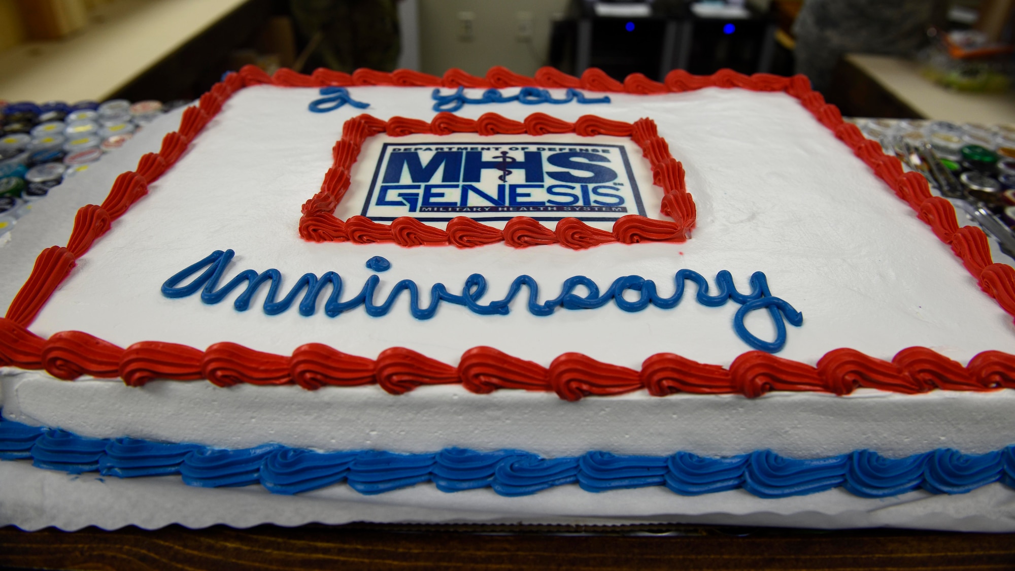 A cake celebrating the second year anniversary of Military Health System Genesis' arrival to Fairchild's 92nd Medical Group at Fairchild Air Force Base, Washington, Feb. 8, 2019. MHS Genesis is a Department of Defense-wide electronic health record and management system that combines health records from base, civilian and Veteran’s Affairs primary care providers, pharmacies, laboratories and dental clinics into one network. (U.S. Air Force photo/Airman 1st Class Lawrence Sena)
