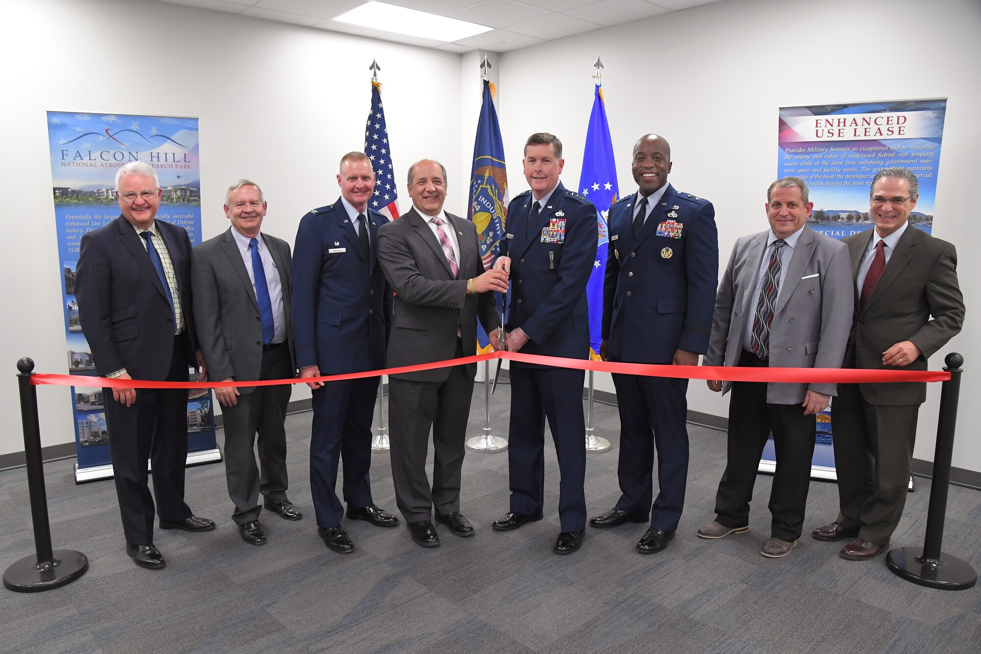 (Left to right) Randall Woodbury, Woodbury Corporation president, Dave Williamsen, Enhanced Use Lease program manager, Col. Jon Eberlan, 75th Air Base Wing commander, Gary Harter, Utah Department of Veterans and Military Affairs executive director, Lt. Gen. Gene Kirkland, Air Force Sustainment Center commander, Maj. Gen. Stacy Hawkins, Ogden Air Logistics Complex commander, Jim Diamond, 309th Software Maintenance Group director, and Juan Gonazales-Garza, Hunt Companies Inc. vice president of development, cut a ribbon during a ceremony Feb. 8, 2019, celebrating the opening of a new 309th Software Maintenance Group support facility at Hill Air Force Base, Utah. The $35 million facility has 15,300 square feet of laboratory space and will accommodate an anticipated growth of around 1,600 personnel currently to more than 3,000 personnel over the next decade. Construction of the facility was funded in part by the Utah state legislature that appropriated $21.5 million. (U.S. Air Force photo by Todd Cromar)