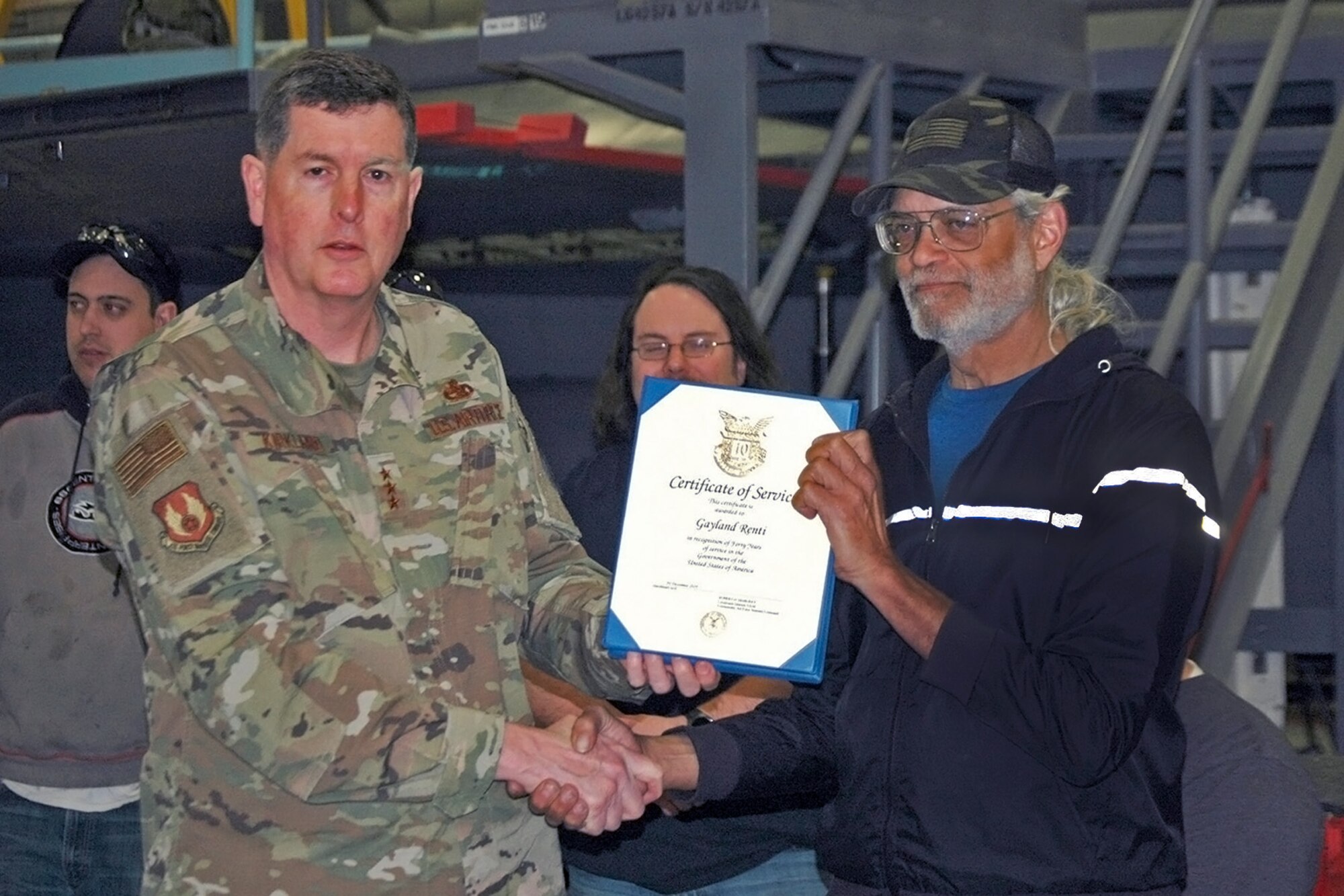 Gayland D. Rentie, 573rd Aircraft Maintenance Squadron, receives a 40-year certificate of service from Lt. Gen Gene Kirkland, Air Force Sustainment Center commander, Feb. 4, 2019, at Hill Air Force Base, Utah. (U.S. Air Force photo by Donovan Potter)