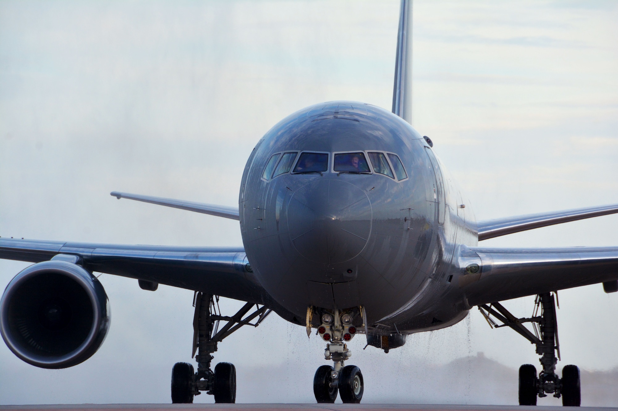 The first KC-46A Pegasus to arrive at Altus Air Force Base, Oklahoma, taxis on the flightline Feb. 8, 2019, following a water salute. Total force Airmen there will put the KC-46 through its paces in the Combat Mobility and Expeditionary Training Center of Excellence, where more than 2,000 airlift and aerial refueling aircrew members train annually. (U.S. Air Force photo by Tech. Sgt. Samantha Mathison)