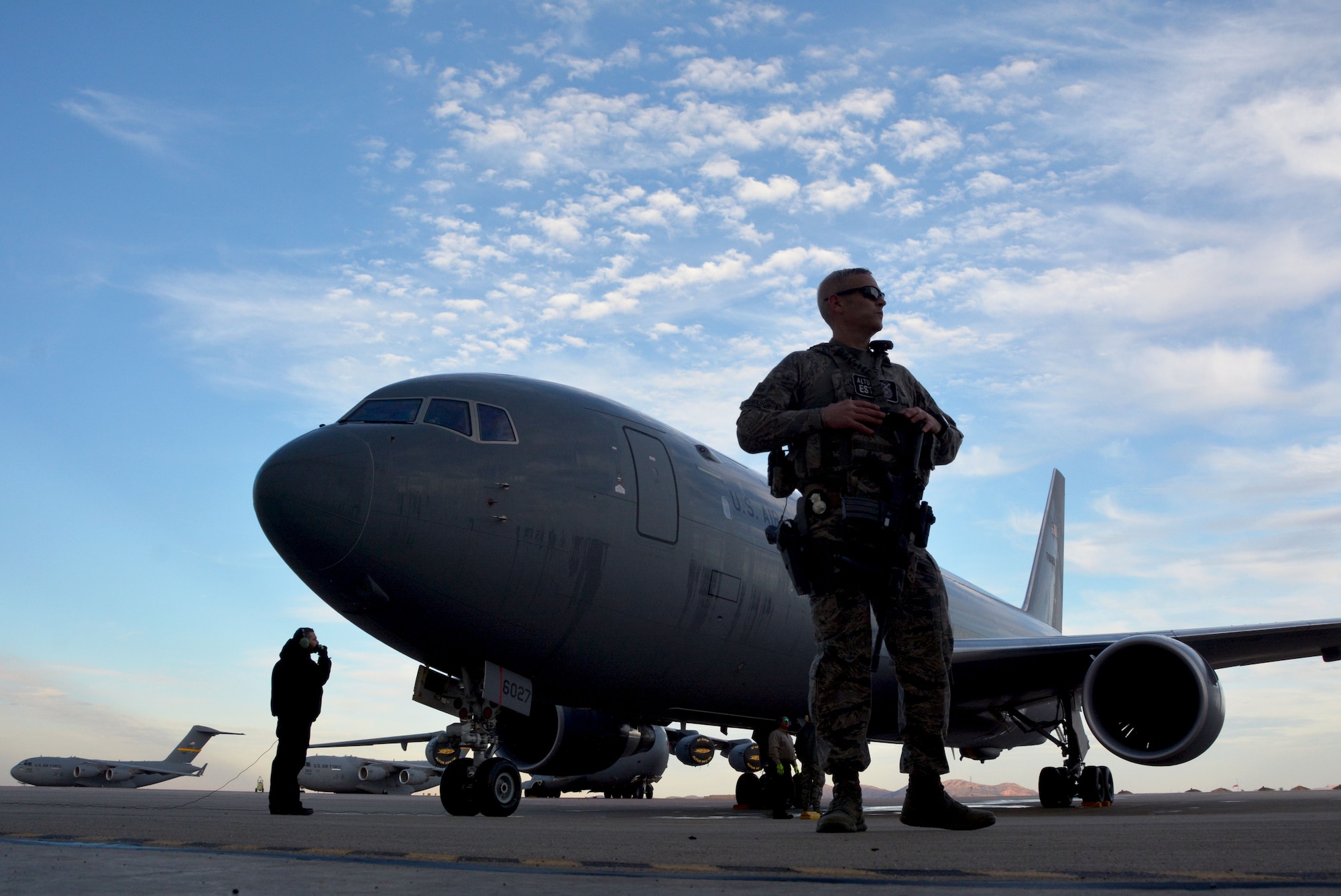 A 97th Air Mobility Wing security forces defender guards a KC-46A Pegasus during post-flight checks at Altus Air Force Base, Oklahoma, Feb. 8, 2019. The 730th Air Mobility Training Squadron, which falls under AFRC’s 507th Air Refueling Wing at Tinker AFB, Oklahoma, is an associate unit that merges with active duty Airmen in the 97th AMW to accomplish aircrew training.(U.S. Air Force photo by Tech. Sgt. Samantha Mathison)